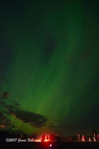 Northern Lights and small bonfire at Astotin Lake in Elk Island Park.