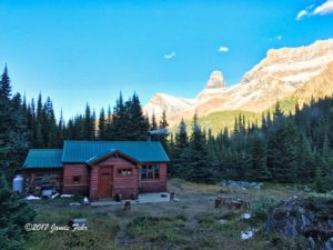 Cabin in mountains daytime.