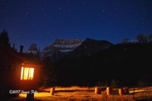 Cabin in mountains nightime.