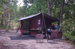 Our tent is all set up, viewed from the back. The table & chairs and kitchen are also set up.