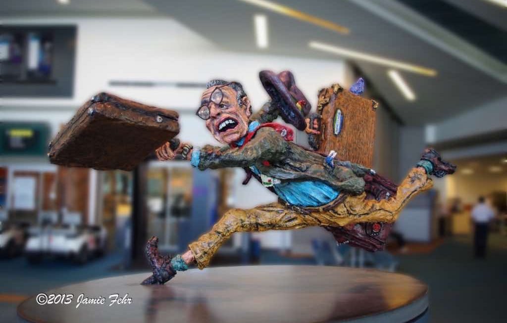 "The Flying Traveller" statue in the Vancouver Airport, it looks like he missed a flight.